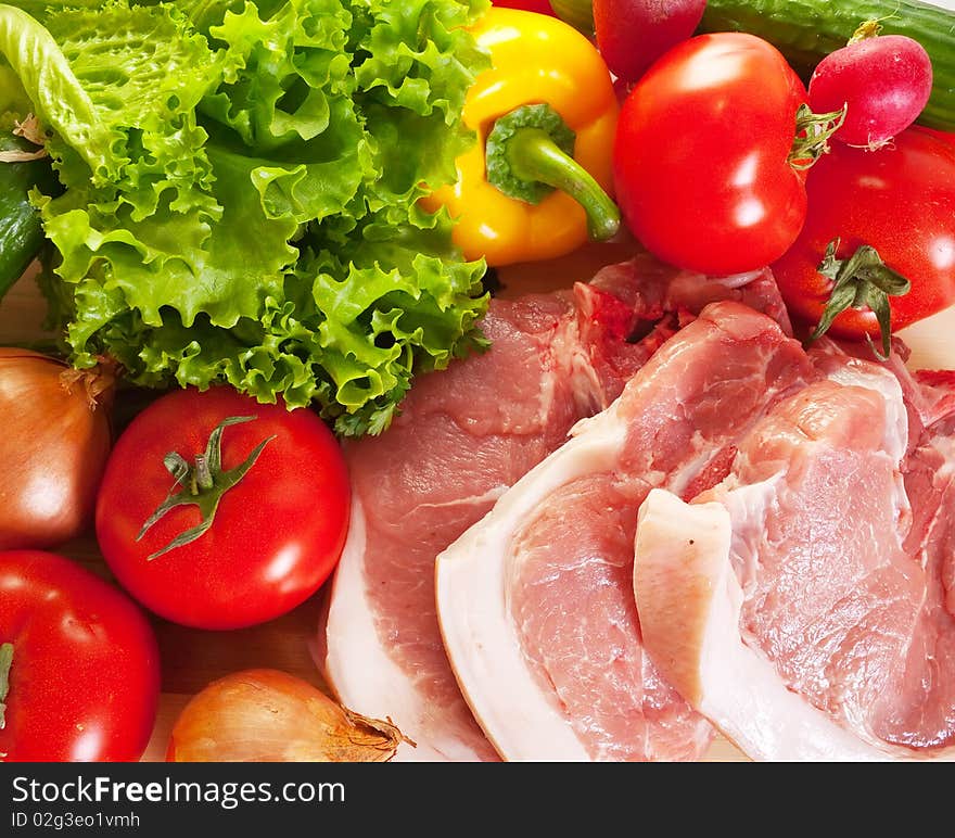 Raw pork and spring fresh and ripe vegetables. Raw pork and spring fresh and ripe vegetables