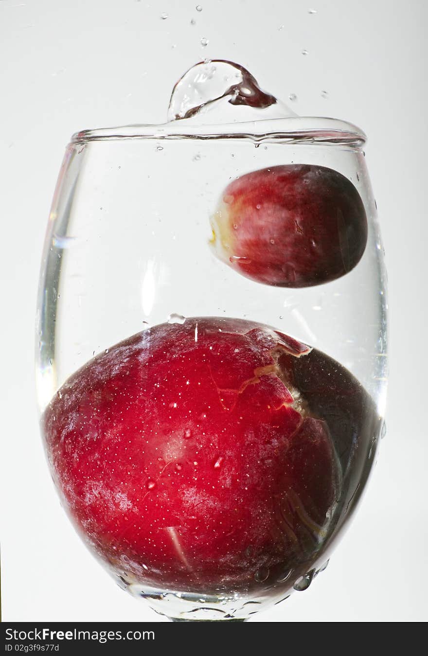 Splash Of Water With Grape Fruit And Cherry