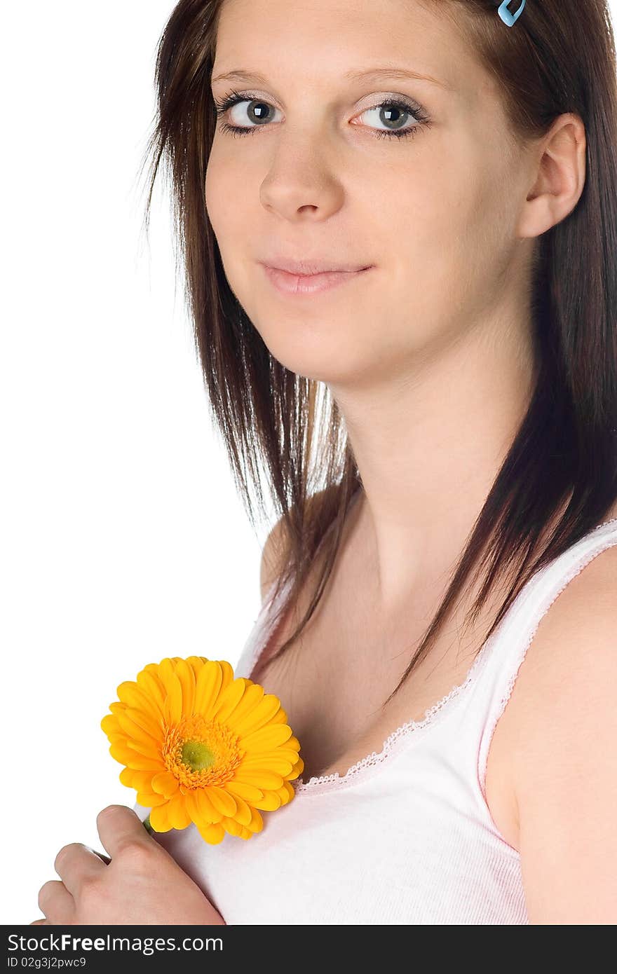 Girl with a orange gerbera flower in the hand isolated on white background. Girl with a orange gerbera flower in the hand isolated on white background