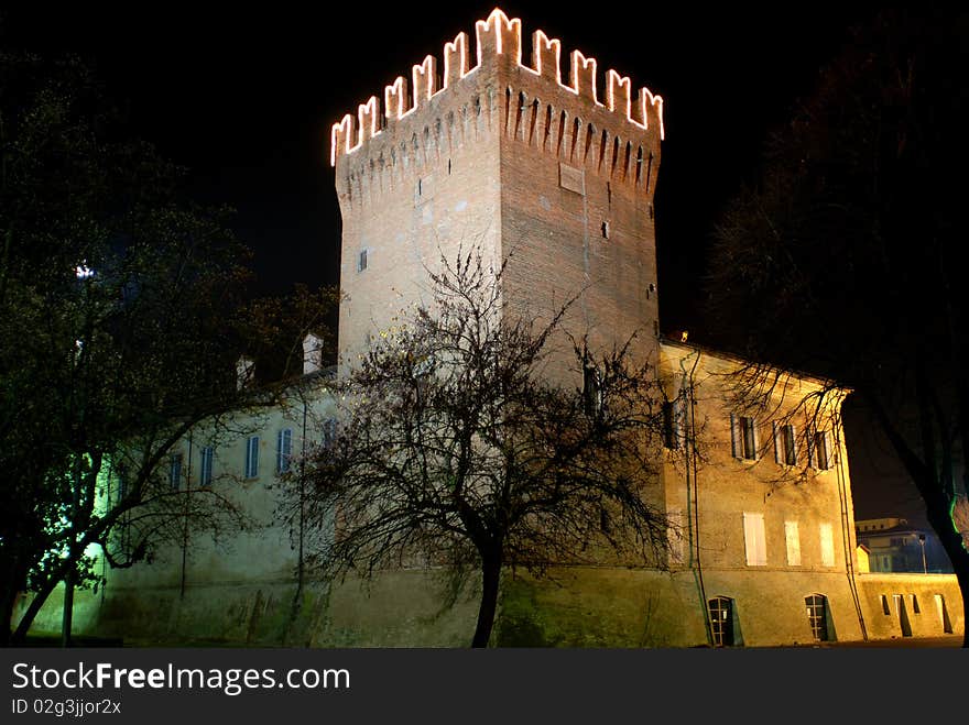 Old italian medieval tower  by night. Old italian medieval tower  by night