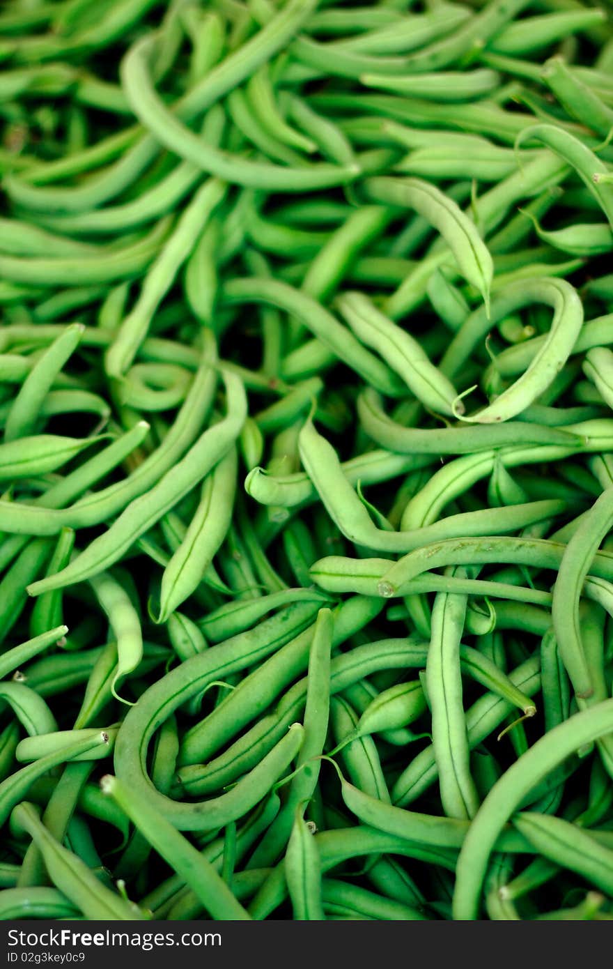 Bunch of fresh green beans on the market for sale