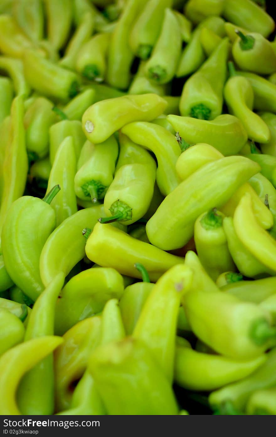 Bunch of organic green peppers on the market for sale