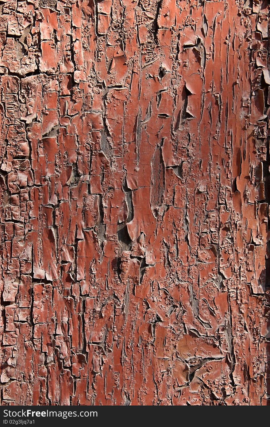 Abstraction, an old wooden surface red, peeling paint