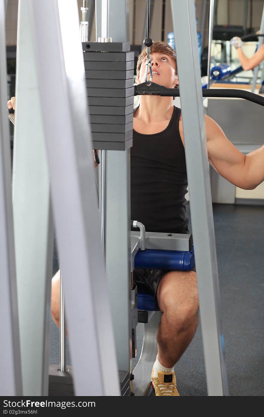 Sporty man in the gym centre. Sporty man in the gym centre.