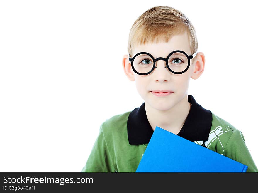 Portrait of a boy in a funny glasses holding a book. Isolated over white background. Portrait of a boy in a funny glasses holding a book. Isolated over white background.