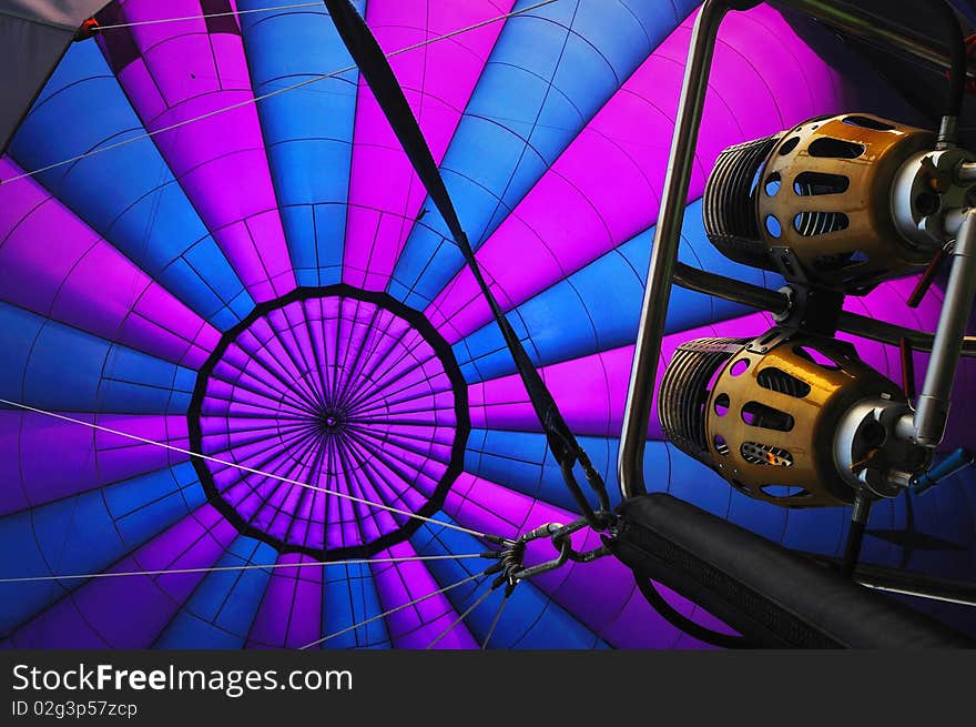 Looking up to see an inside colorful balloon. Looking up to see an inside colorful balloon