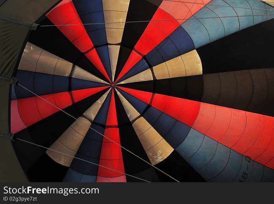 Looking up to see an inside colorful balloon. Looking up to see an inside colorful balloon