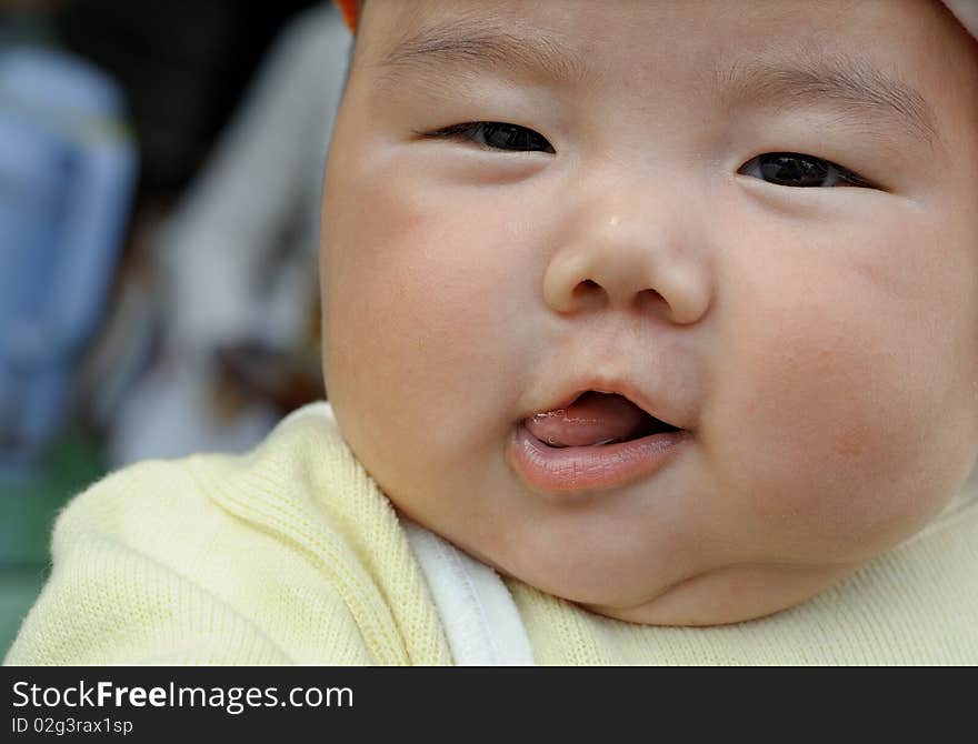 A cute baby with lively face.