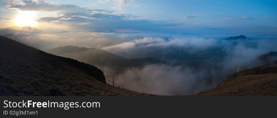 Panorama of mountains in the mist