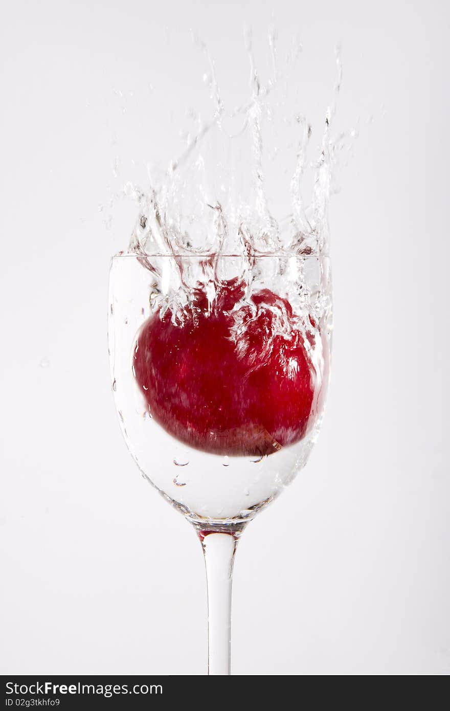 Splash Of Water With Cherry Fruit