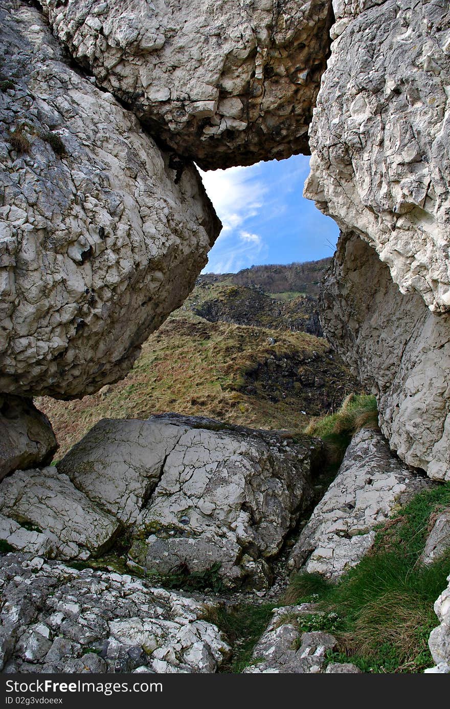 A view of the Antrim hills through a limestone window. A view of the Antrim hills through a limestone window.