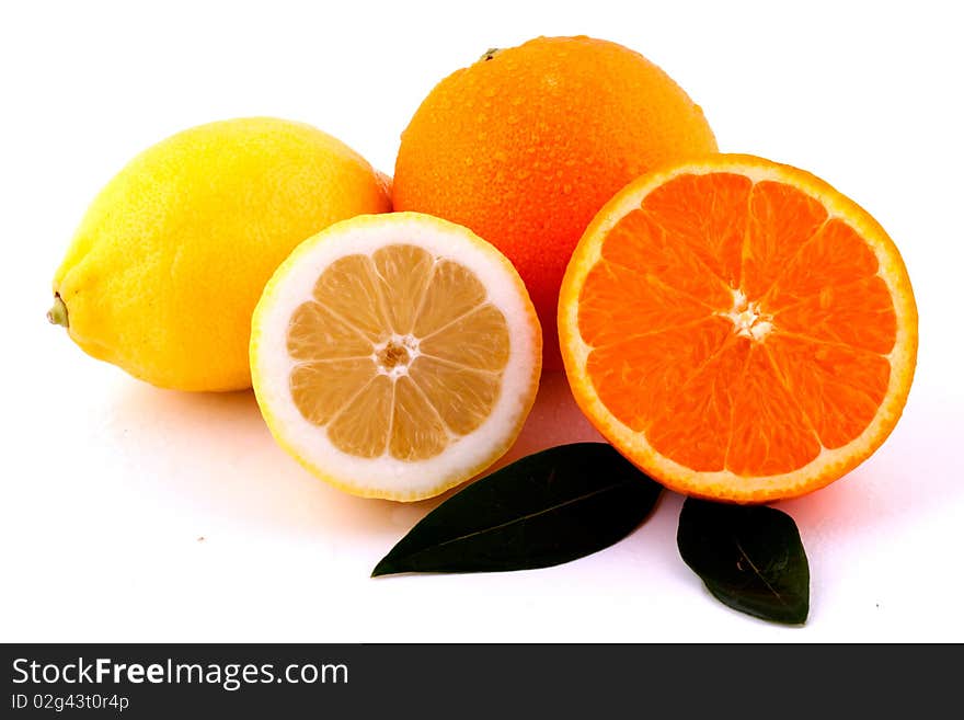 Oranges and Lemons Whole and Halves on White Background