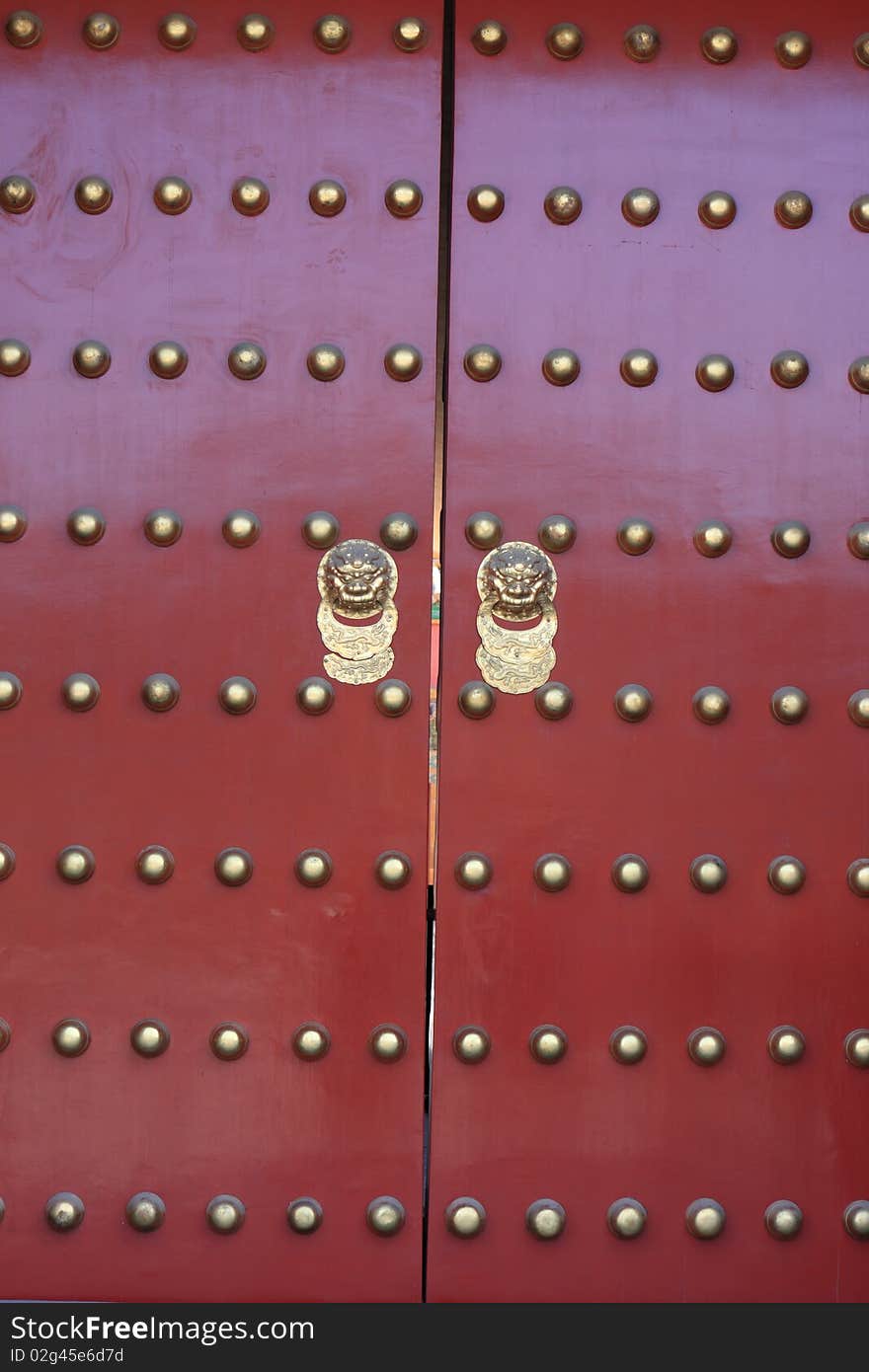 Red door of temple in forbidden city was the Chinese imperial palace. It is located in Beijing, China.