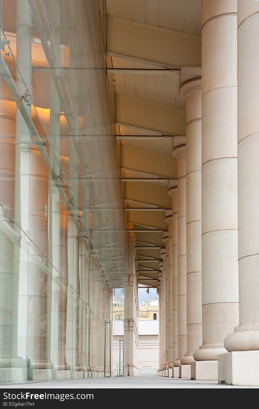 This is one of the sides of Teatre Nacional de Catalunya's building. The space between the columns and the glass structure forms long corridors at each side of the building. This is one of the sides of Teatre Nacional de Catalunya's building. The space between the columns and the glass structure forms long corridors at each side of the building.