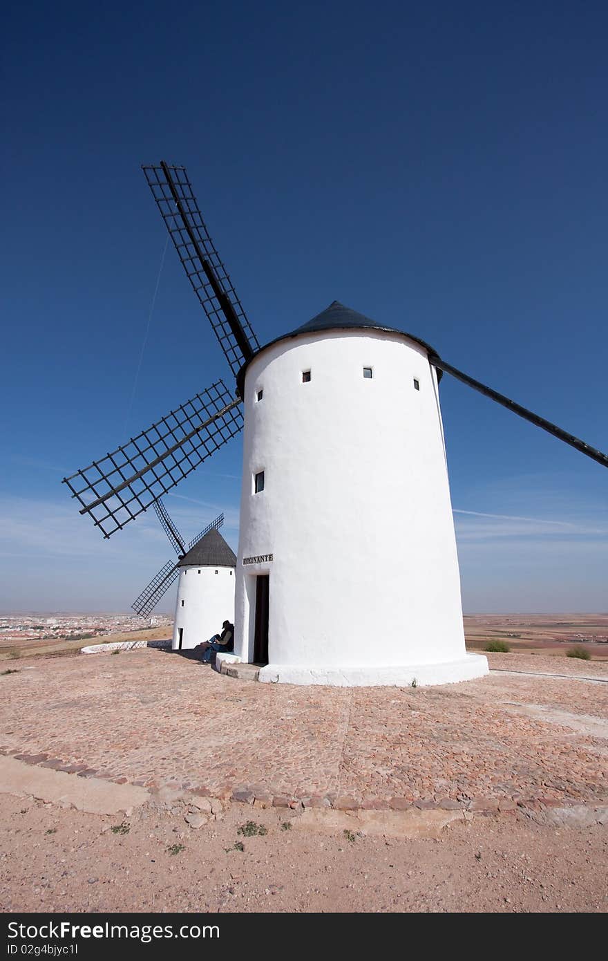 Two traditional spanish windmills against blue sky. Two traditional spanish windmills against blue sky.