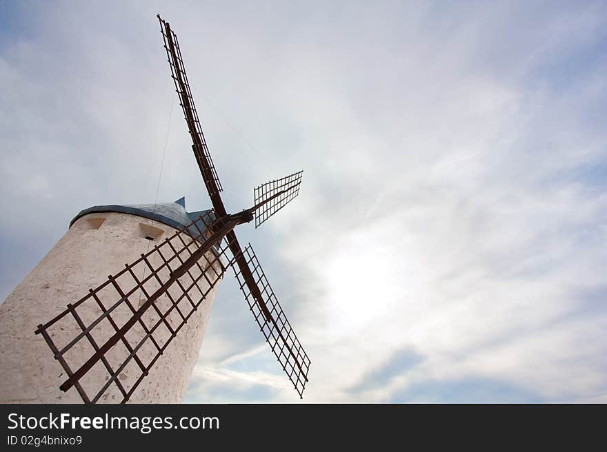 A Windmill in Consuegra (Castilla La Mancha, Spain) against a cloudy sky. A Windmill in Consuegra (Castilla La Mancha, Spain) against a cloudy sky.