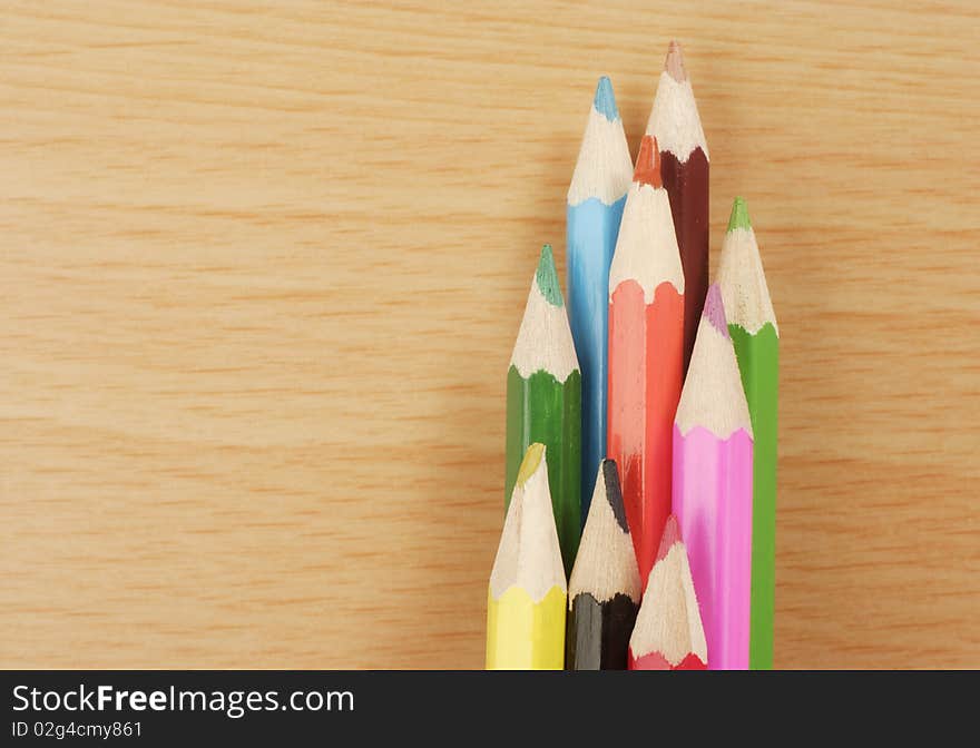 Colored Pencils on wooden desk