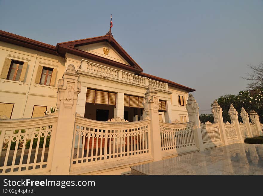 Beige building with flag stuck on the roof. Beige building with flag stuck on the roof