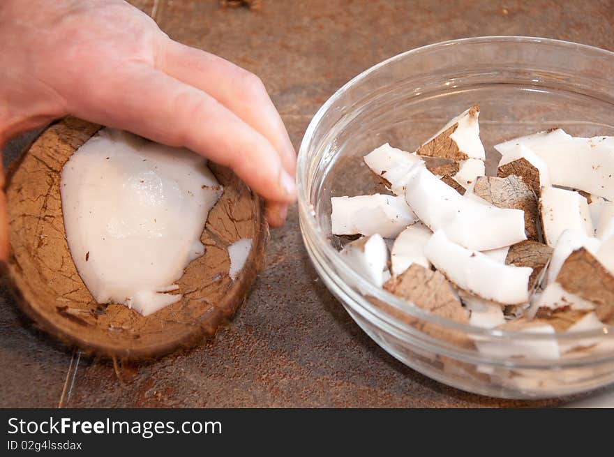 Man preparing coconuts for the kids. Man preparing coconuts for the kids.