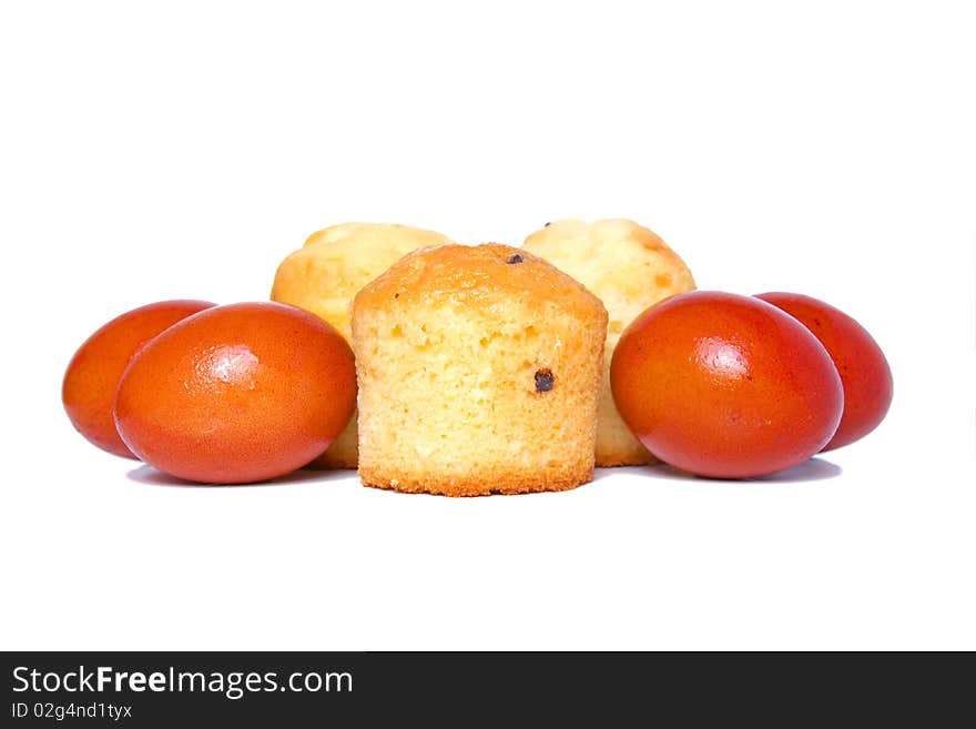 Russian Easter food colored eggs and cakes isolated on white