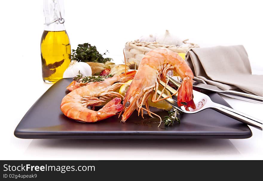 Barbequed prawn salad with lemon, macro closeup