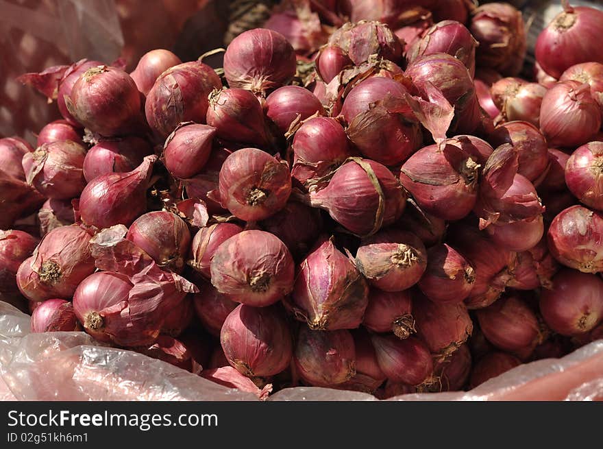 Red Onion sold on the fresh plant market. Red Onion sold on the fresh plant market.