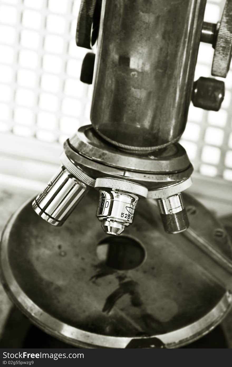 Old microscope close up. Retro.