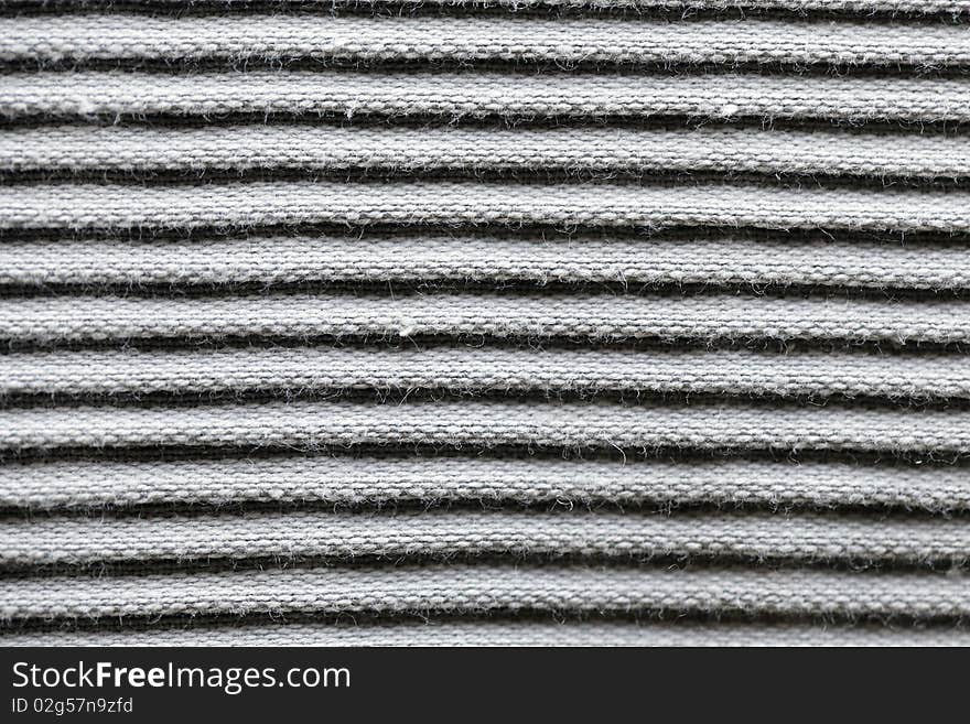 Cotton fabric in fringes or stripes as texture or background. Cotton fabric in fringes or stripes as texture or background.