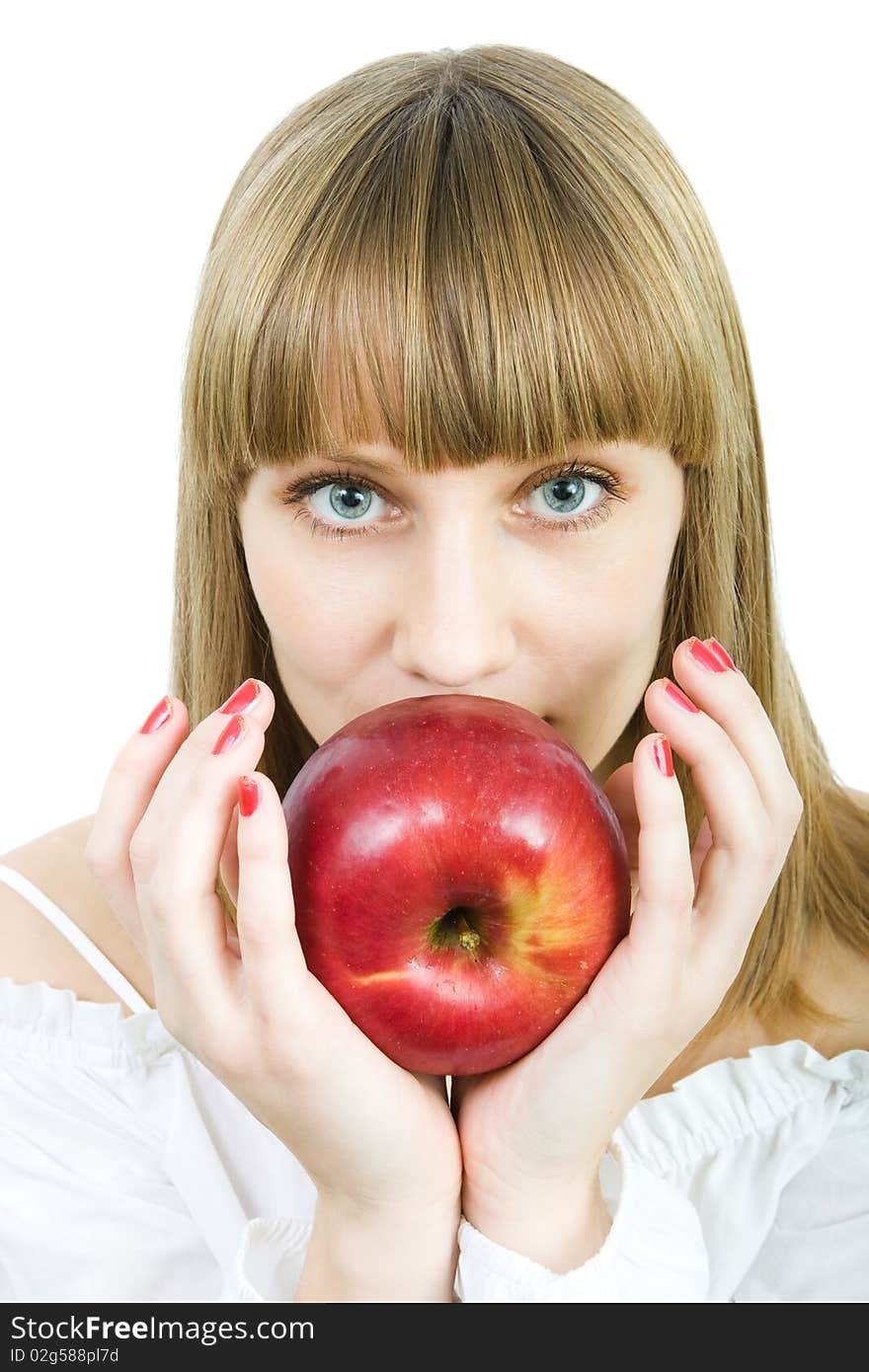 Young beautiful woman with a red apple on a white background