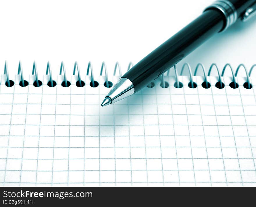 The image of the page of notepad and pen. The image of the page of notepad and pen