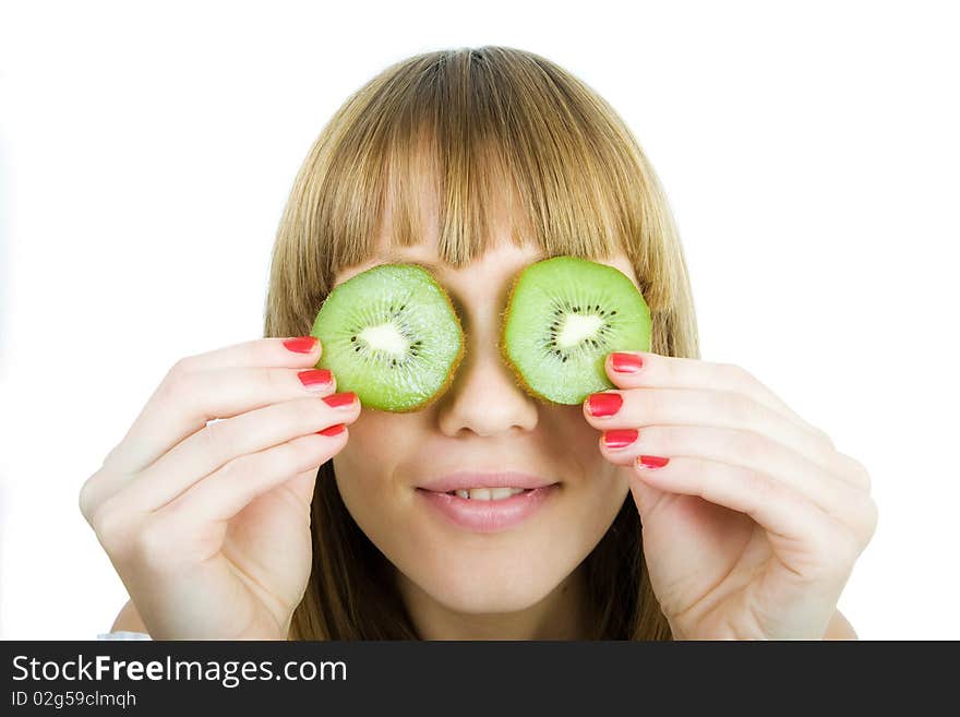 Young Woman Holding Kiwi Slices in Front of Eyes