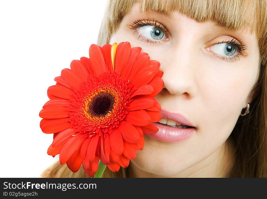 Portrait of a young woman with red flower gerbera