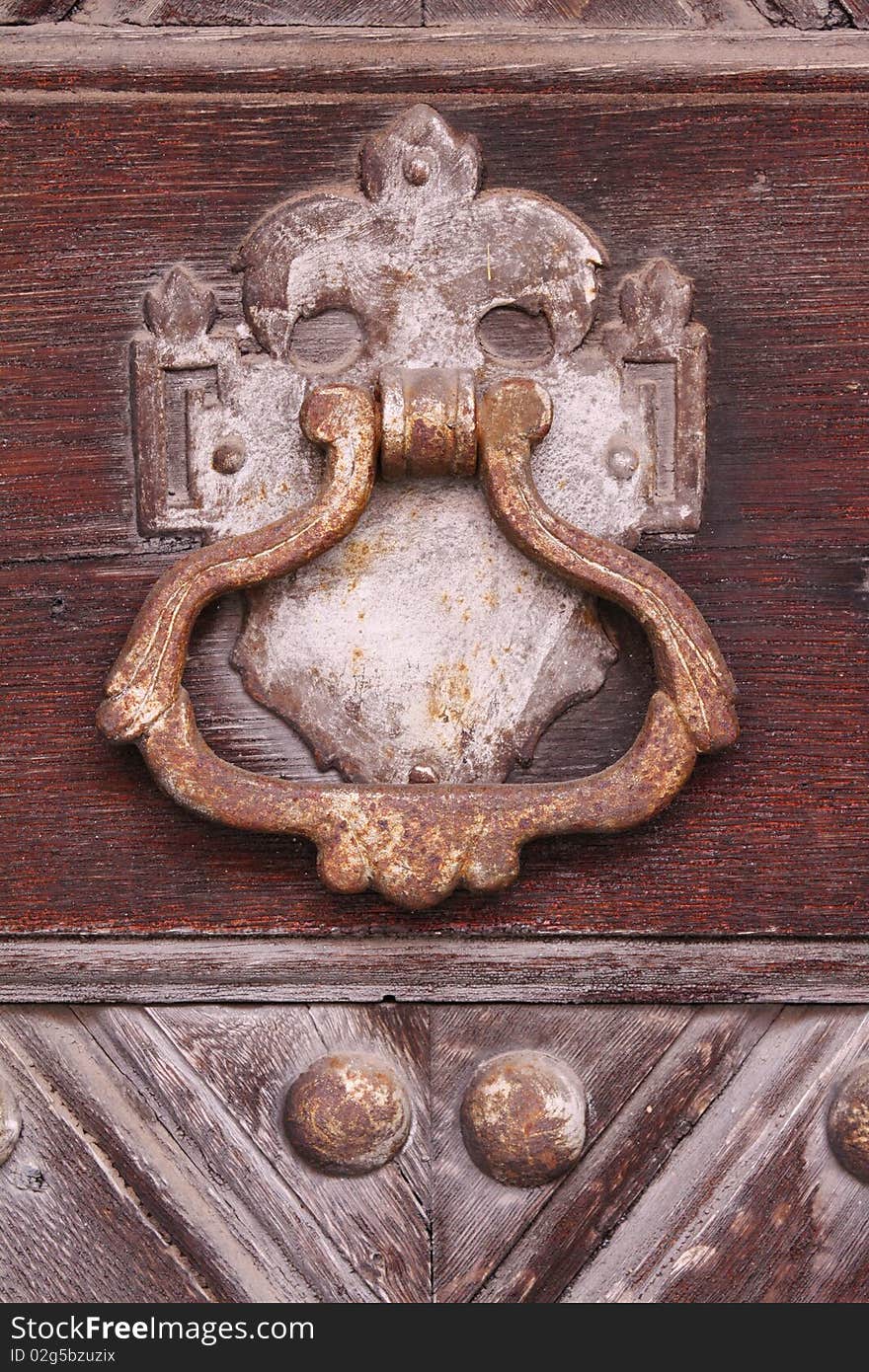 Old knocker on historical door. Old knocker on historical door