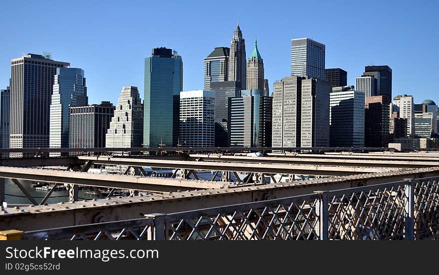 Scenic view of Lower Manhattan skyline with Brooklyn Bridge in foreground, New York city, U.S.A.