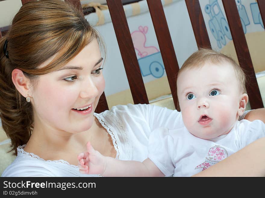 Young beautiful mother with litlle cute baby daughter. Young beautiful mother with litlle cute baby daughter