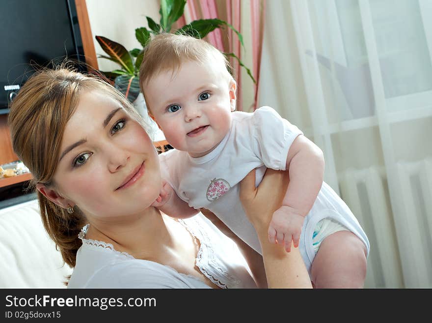 Young beautiful mother with litlle cute baby daughter. Young beautiful mother with litlle cute baby daughter