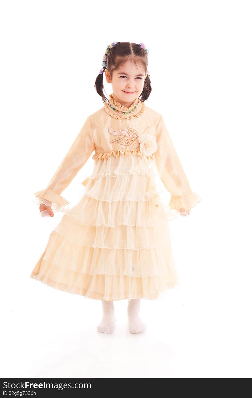 The Little Girl In A Dress Isolated On A White