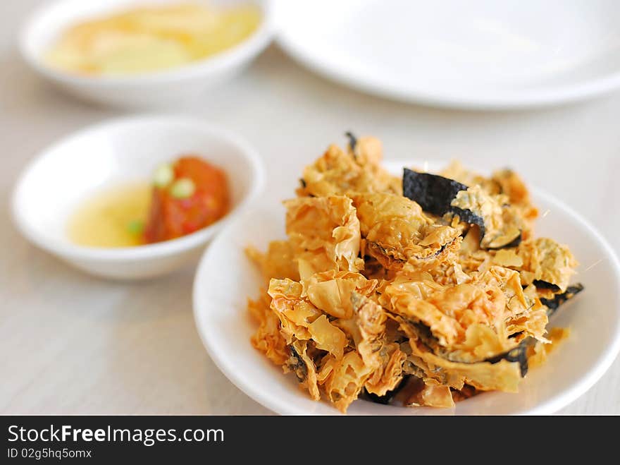 Chinese vegetarian appetizers before the main course. Made from deep fried bean curd skin. Suitable for food and beverage, healthy lifestyle, and diet and nutrition. Chinese vegetarian appetizers before the main course. Made from deep fried bean curd skin. Suitable for food and beverage, healthy lifestyle, and diet and nutrition.