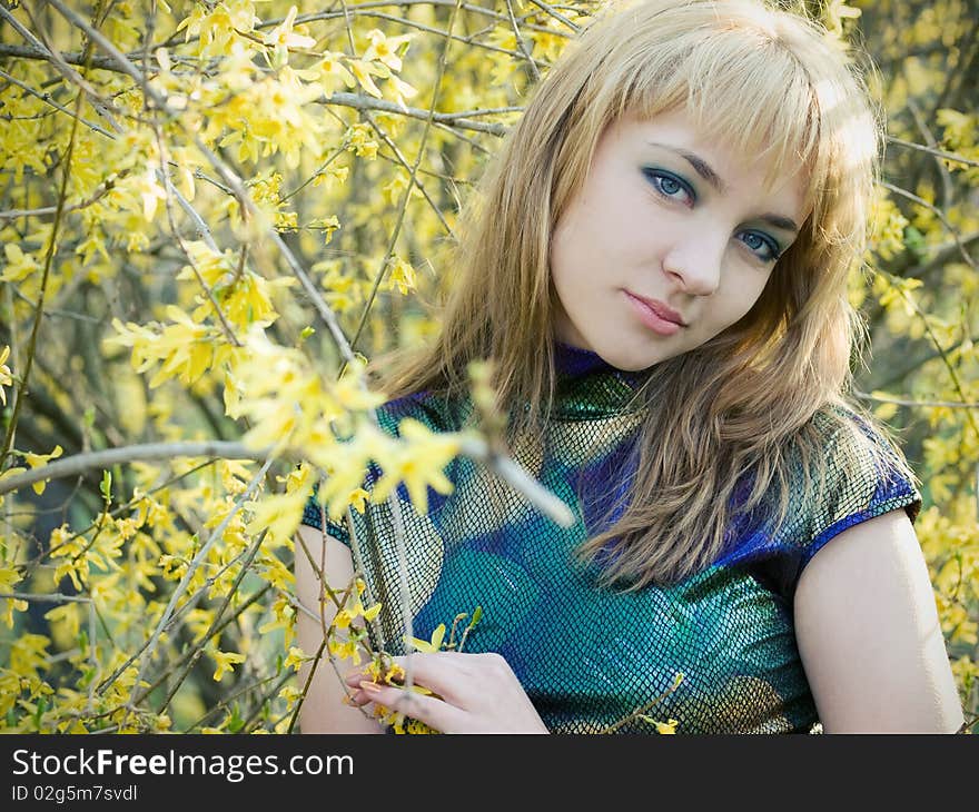 Beautiful young girl resting in spring garden. Beautiful young girl resting in spring garden