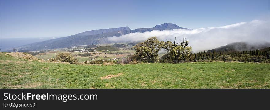 Landscape of plains and mountains under the clouds. Landscape of plains and mountains under the clouds