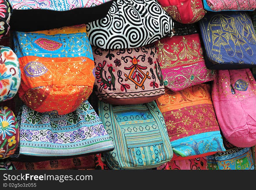 The pictures show the handicraft (bags) displayed on the wall at ladies street, mong kok, hong kong where is one of the famous place in hong kong. the bags are colorful, with special pattern. The pictures show the handicraft (bags) displayed on the wall at ladies street, mong kok, hong kong where is one of the famous place in hong kong. the bags are colorful, with special pattern