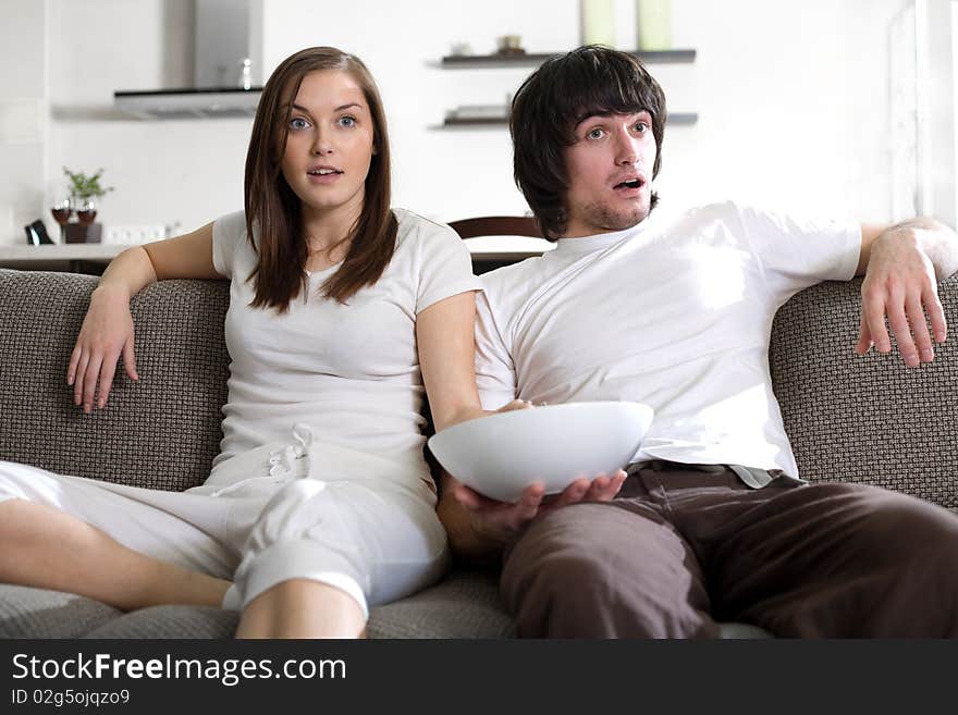 Boy with plate and beautiful girl with long hair