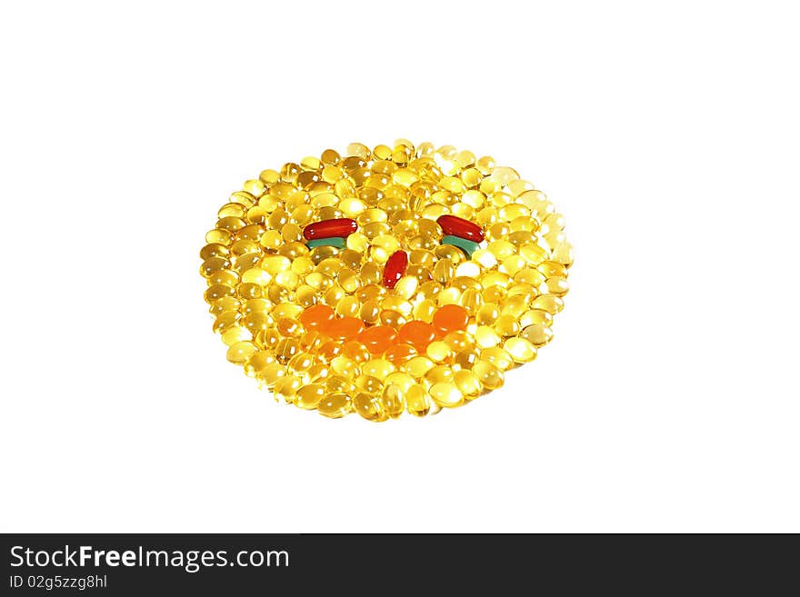 Yellow transparent pills in the shape of face