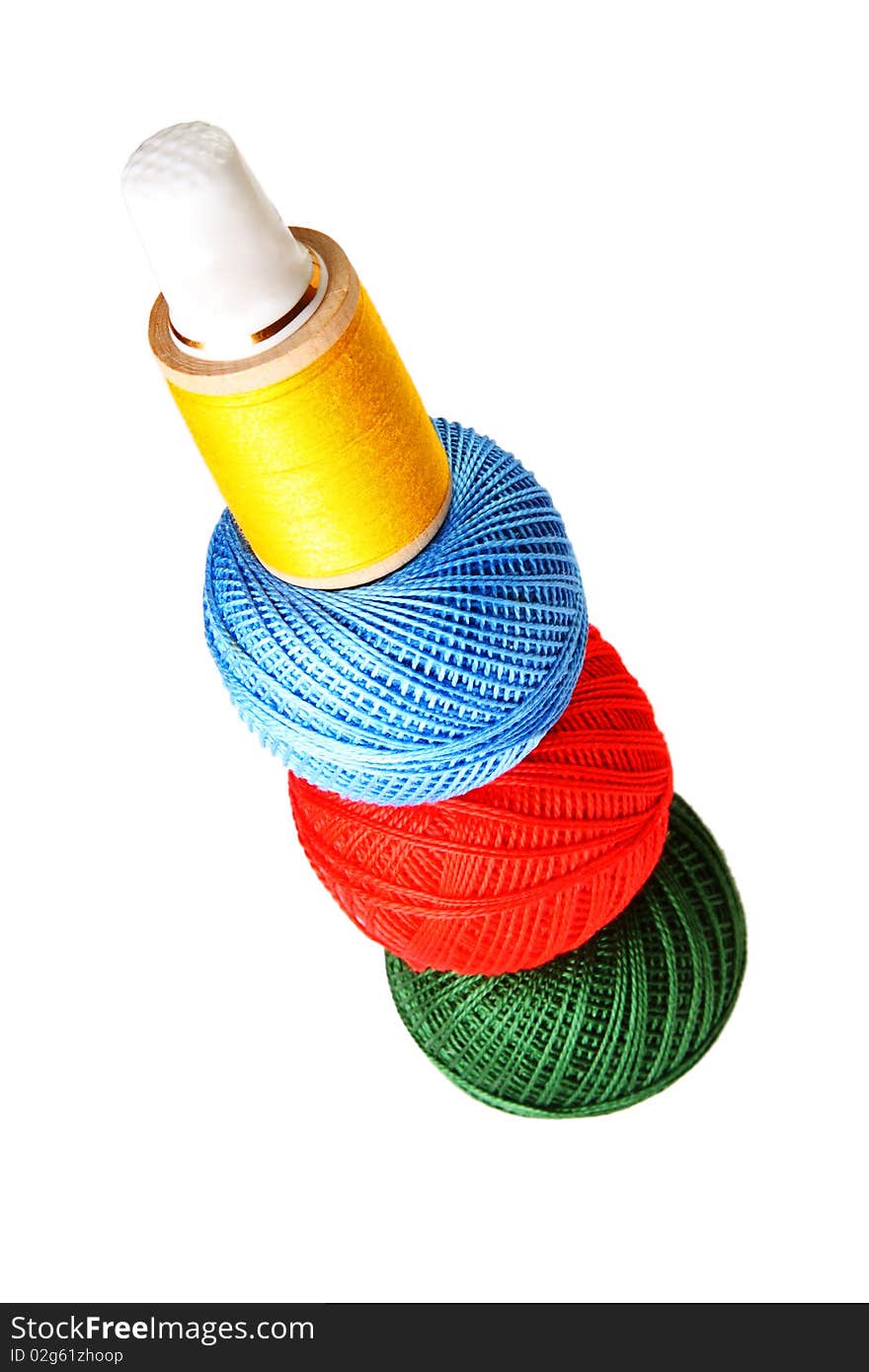 Colorful sewing balls in a stack isolated