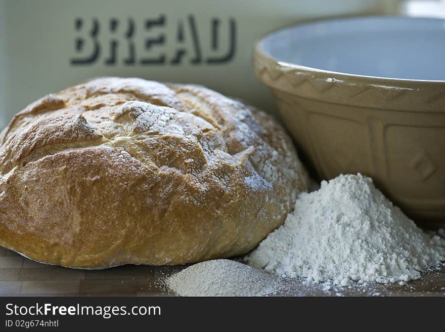 A Loaf Of Freshly Baked White Bread With Ingredients