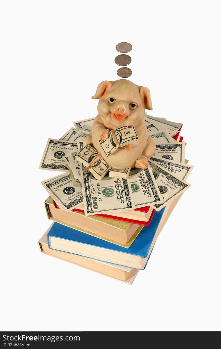 Piggy Bank with flying money staying on the books