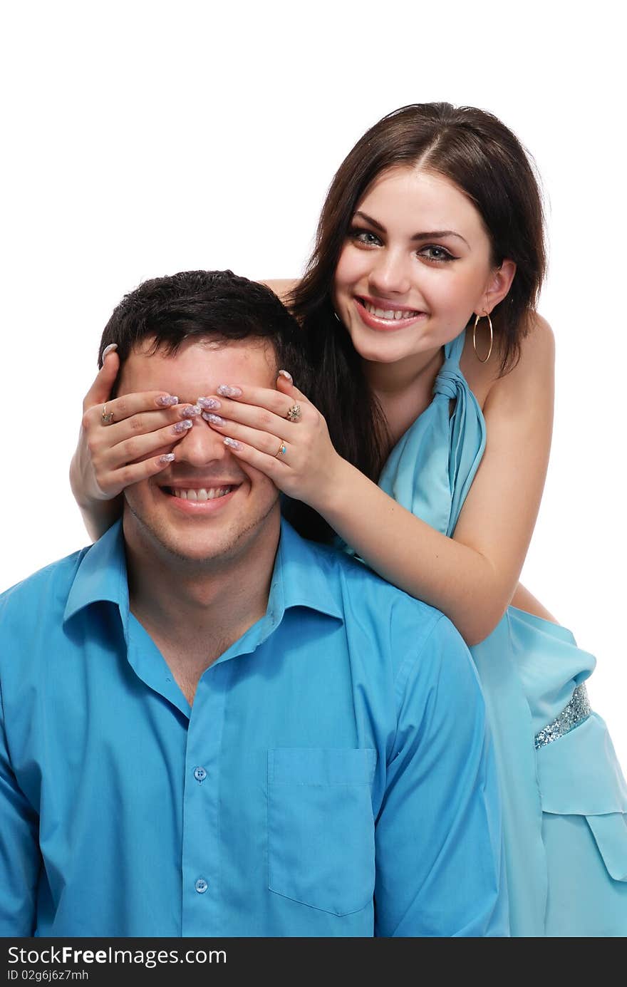 A beautiful young couple posing in studio