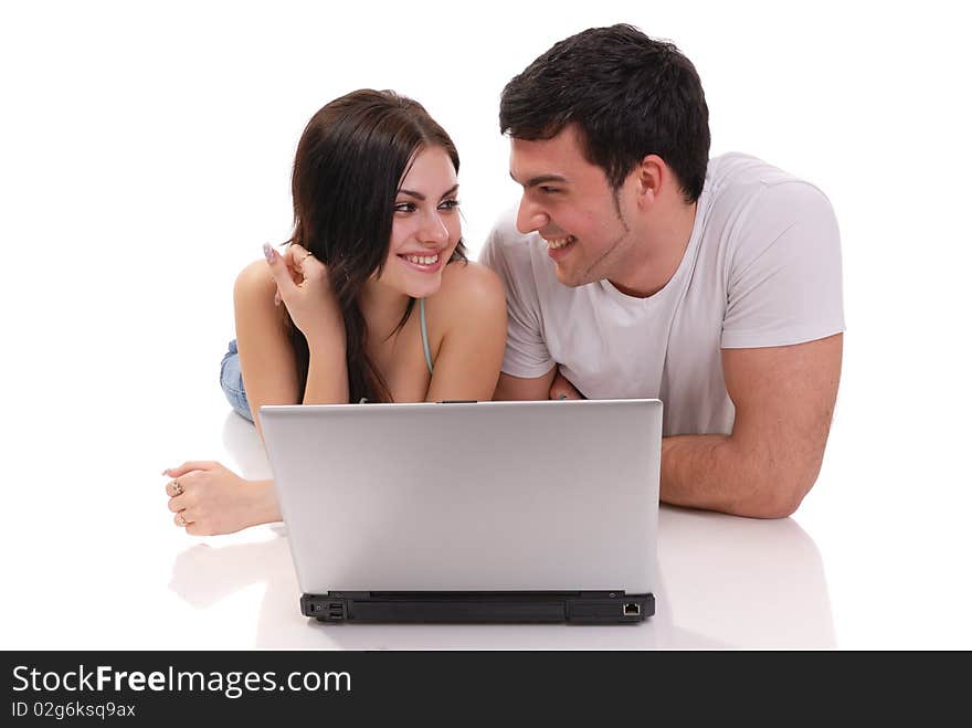 A beautiful young couple posing in studio