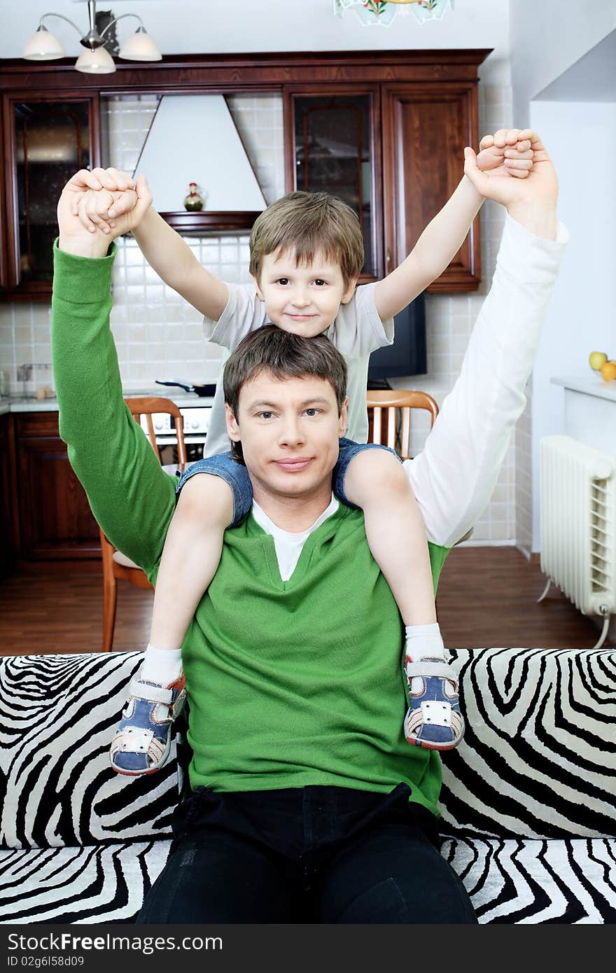 Happy father with his son at home. Happy father with his son at home.