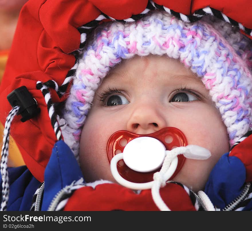 Beautiful baby with baby's dummy